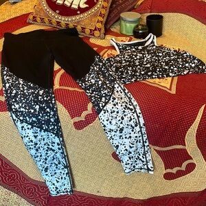 Fabletics black and white athletic wear leggings and bra top set